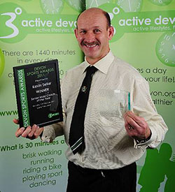 Image of Kevin Sellar with Devon Sports Award