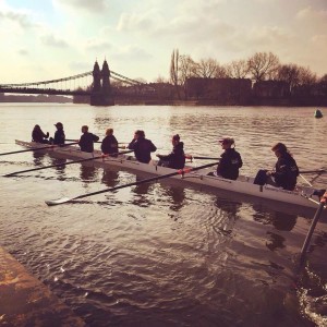Women's eight afloat by Hammersmith Bridge
