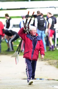 Ron Needs, former GB Rowing Coach carrying blades