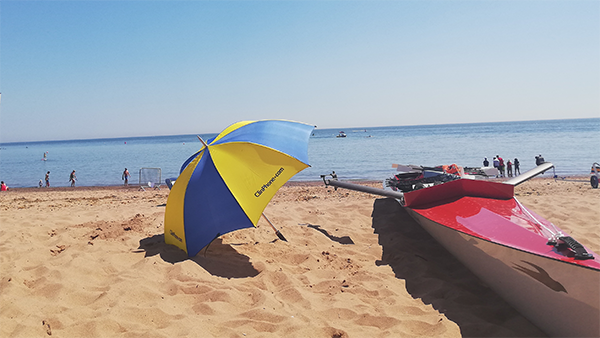 umbrella and boat on beach