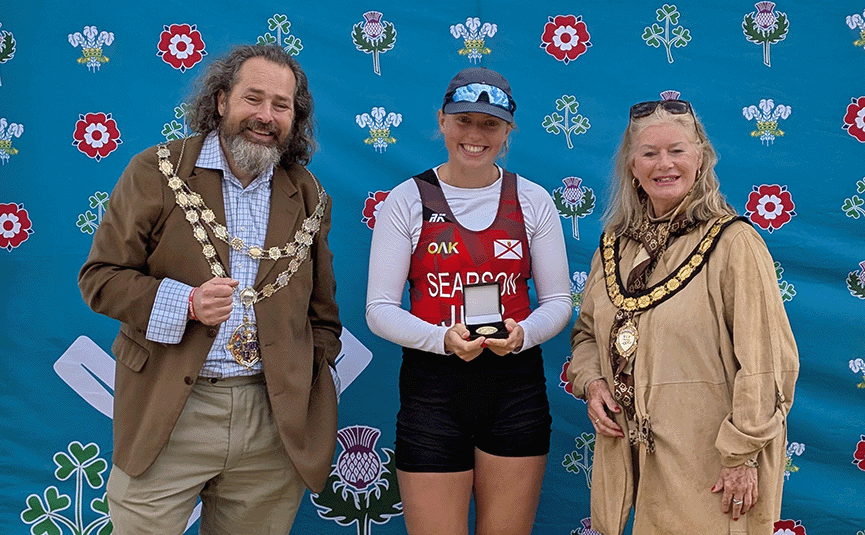 Woman being presented with medal