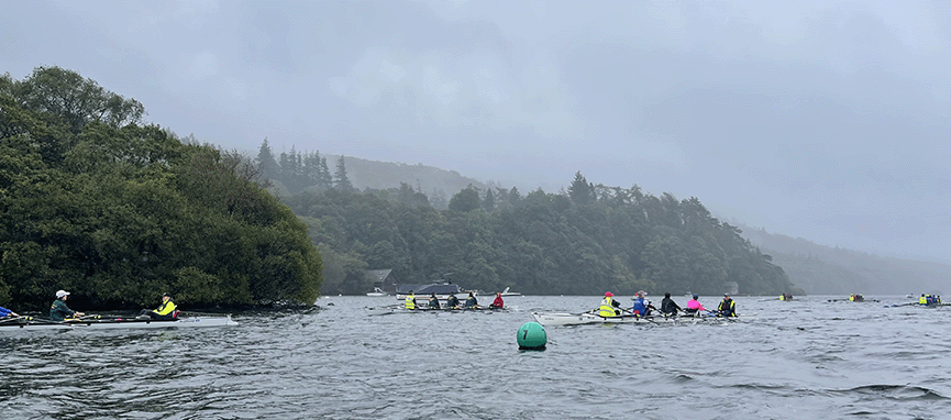 Crews rowing in rain on Cumbrian lake