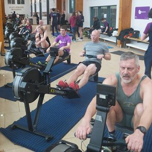 Bradford ARC members, teachers and pupils rowing side-by-side