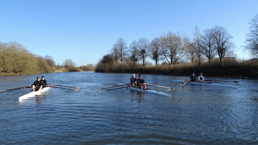 3 double sculls on river