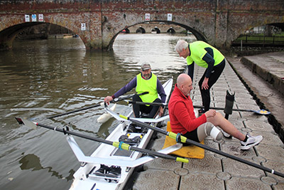 Adaptive rowers getting out of their boat